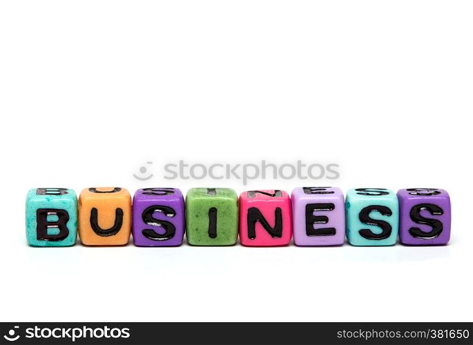 business - word made from multicolored child toy cubes with letters