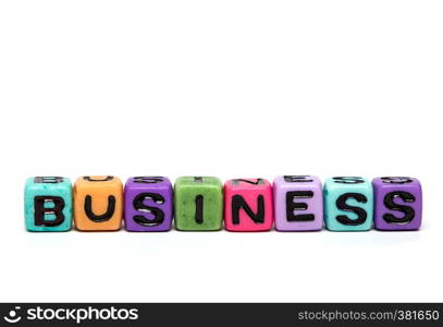 business - word made from multicolored child toy cubes with letters