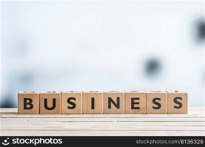 Business word on a wooden sign made of blocks
