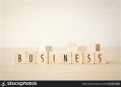 Business word on wooden cubes background, business concept