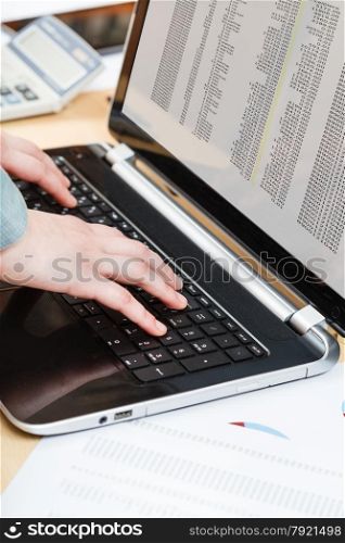 business workflow - businessman working with laptop at office desk