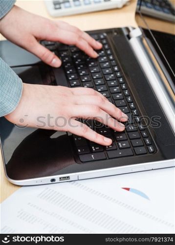 business workflow - businessman working with laptop at office table