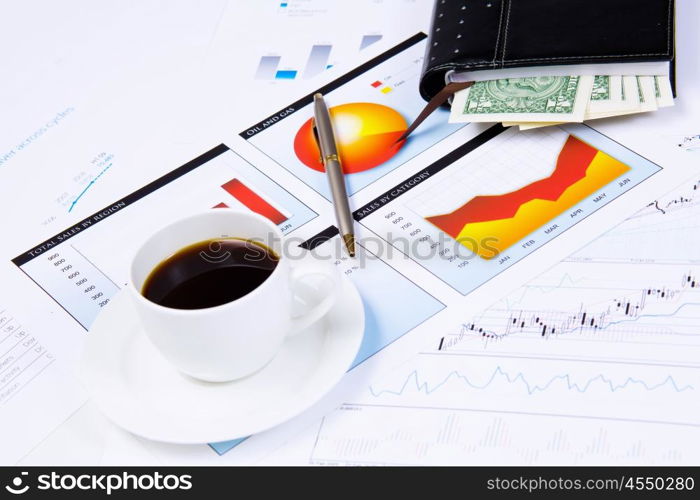 Business workplace. Close up image of office workplace with cup of coffee and documents