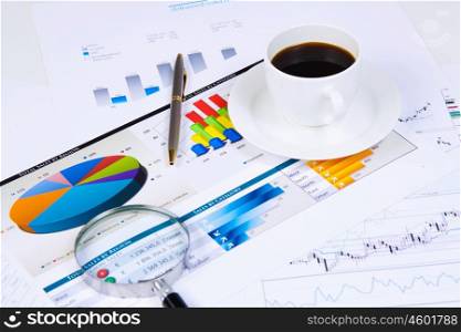 Business workplace. Close up image of office workplace with cup of coffee and documents