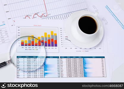 Business workplace. Close up image of office workplace with cup of coffee and documents