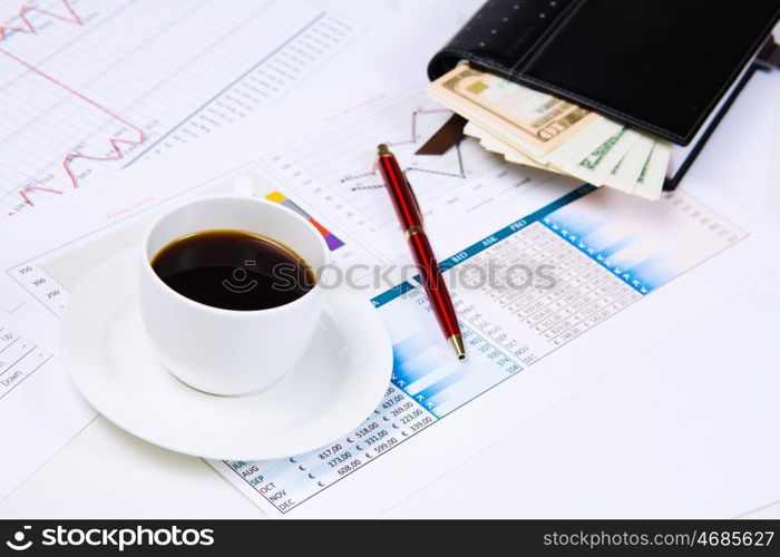 Business workplace. Close up image of office workplace with cup of coffee and documents