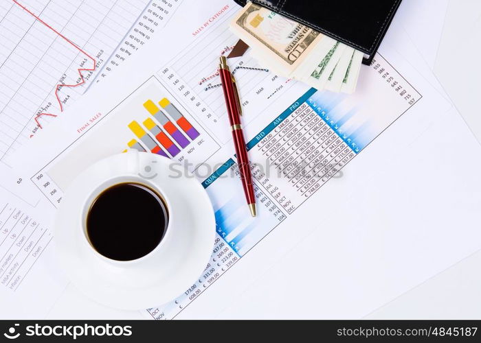 Business workplace. Close up image of office workplace with cup of coffee and documents