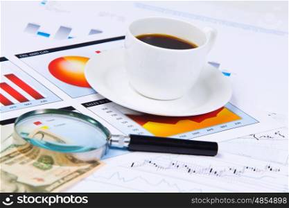 Business workplace. Close up image of office workplace with cup of coffee and documents