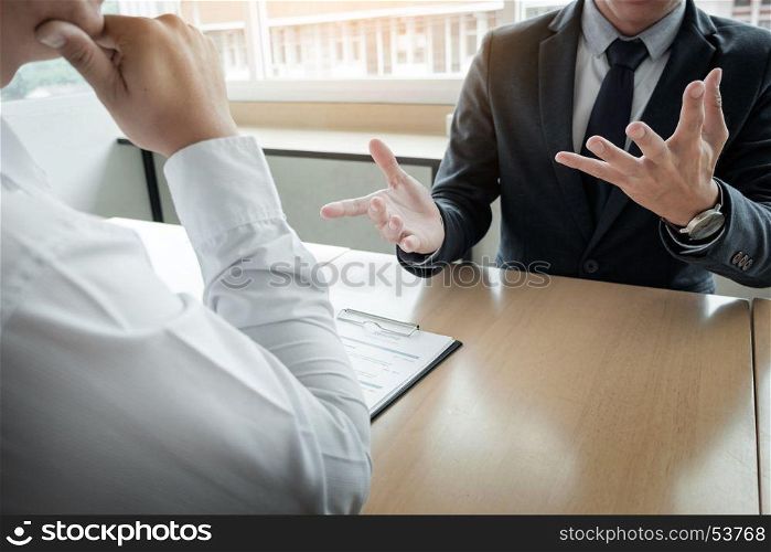 Business - young man explaining about his profile to business managers sitting in job Interview.