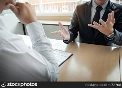 Business - young man explaining about his profile to business managers sitting in job Interview.