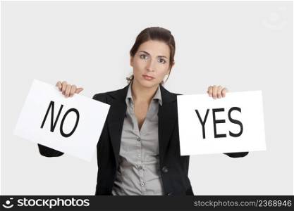 Business young woman trying to make a decision between Yes or No choice