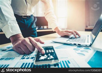 Businessman accountant or financial expert analyze business report graph and finance chart at corporate office. Concept of finance economy, banking business and stock market research.