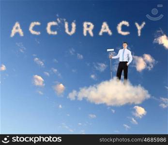 Businessman against blue sky with word accuracy writen