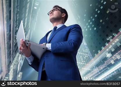 Businessman against buildings in business concept