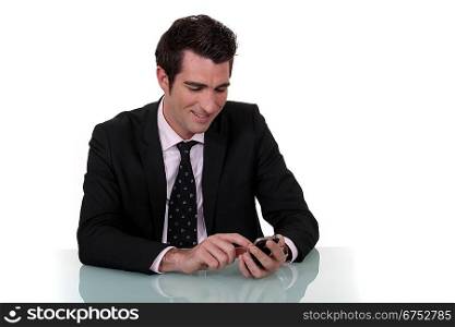 businessman amused at sms