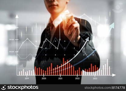 Businessman analyst working with digital finance business data graph showing technology of investment strategy for perceptive financial business decision. Digital economic analysis technology concept.. Businessman working with digital finance business graph of perceptive technology