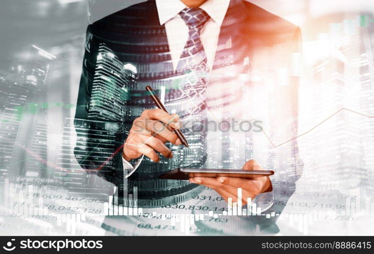 Businessman analyst working with digital finance business data graph showing technology of investment strategy for perceptive financial business decision. Digital economic analysis technology concept.. Businessman working with digital finance business graph of perceptive technology