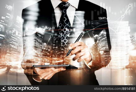 Businessman analyst working with digital finance business data graph showing technology of investment strategy for perceptive financial business decision. Digital economic analysis technology concept.. Businessman working with digital finance business graph of perceptive technology