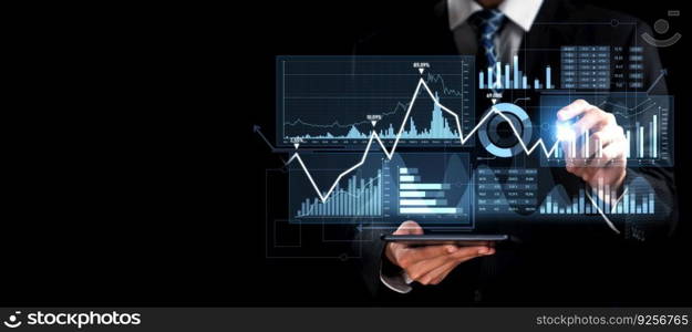 Businessman analyst working with digital finance business data graph showing technology of investment strategy for perceptive financial business decision. Digital economic analysis technology concept.. Businessman working with digital finance business graph of perceptive technology