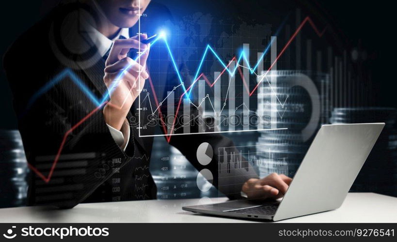 Businessman analyst working with digital finance business data graph showing technology of investment strategy for perceptive financial business decision. Digital economic analysis technology concept.. Businessman working with digital finance business graph of perceptive technology