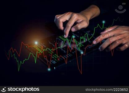 Businessman analyzing financial statistics displayed on the tablet screen. Business analytics and financial technology concept.