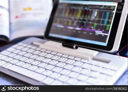 Businessman Analyzing Stock Market Status On Digital Tablet