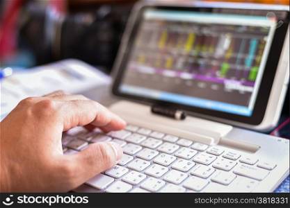 Businessman Analyzing Stock Market Status On Digital Tablet