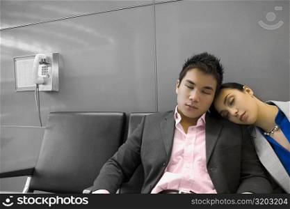 Businessman and a businessman sleeping in the waiting room