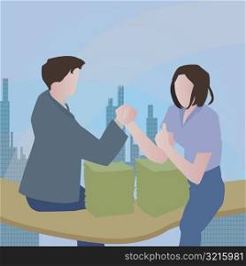 Businessman and a businesswoman arm wrestling