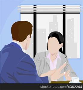 Businessman and a businesswoman talking in an office
