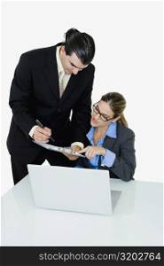 Businessman and a businesswoman working in an office