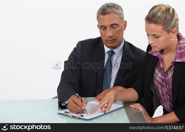 businessman and assistant examining a project