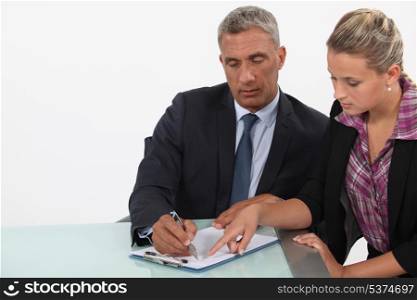 businessman and assistant examining a project