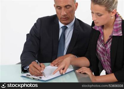 businessman and assistant making a plan