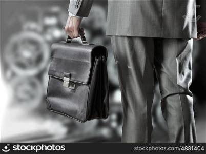 Businessman and business sketches. Rear view of businessman with suitcase in hand
