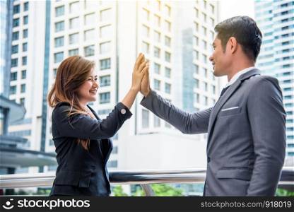 Businessman and business woman doing high five, Business concept, Successful concept, Cooperation concept