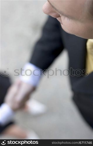 Businessman and business woman giving a handshake with a smile from a high angle view