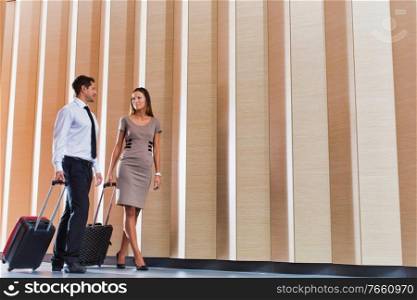 Businessman and businesswoman attending business conference in a hotel