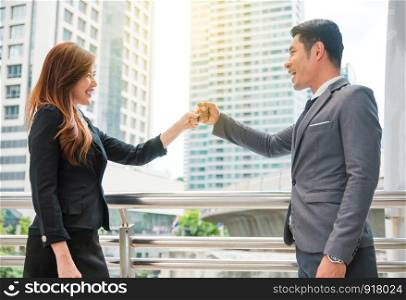 Businessman and businesswoman fist bump together, Business concept, Cooperate concept