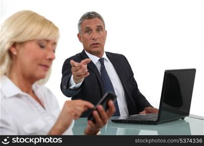 businessman and businesswoman having a discussion