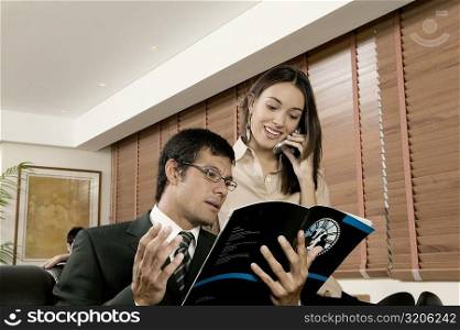 Businessman and businesswoman in an office