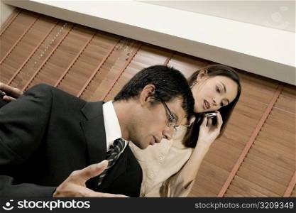 Businessman and businesswoman in an office