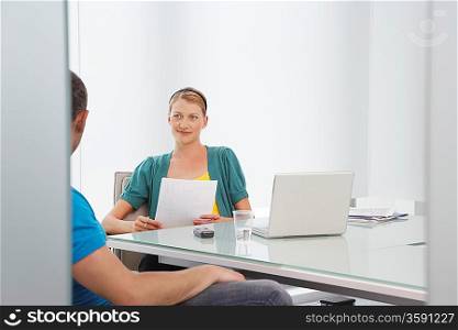 Businessman and Businesswoman in Meeting