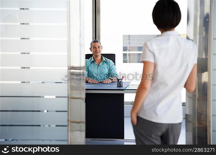 Businessman and Businesswoman in Office