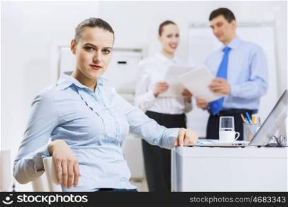 Businessman and businesswoman in office having conversation. Working in partnership