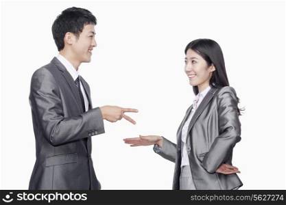 Businessman and businesswoman in playful gesture