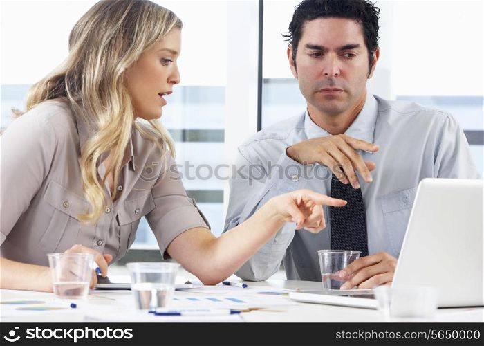 Businessman And Businesswoman Meeting In Office