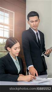 Businessman And Businesswoman Meeting In Office. Business people working