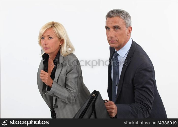Businessman and businesswoman ready to race