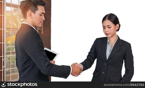 Businessman And Businesswoman Shaking Hand. Businessman And Businesswoman Shaking Hands In Office